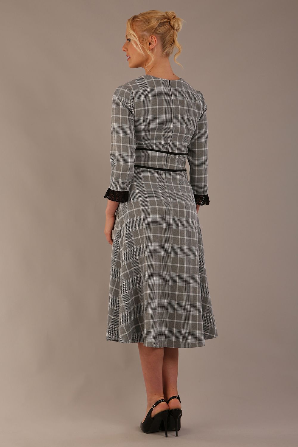 Model wearing the Hendricks check midi dress in misty grey with black lace cuffs and a V-neck (Misty Grey Check)
