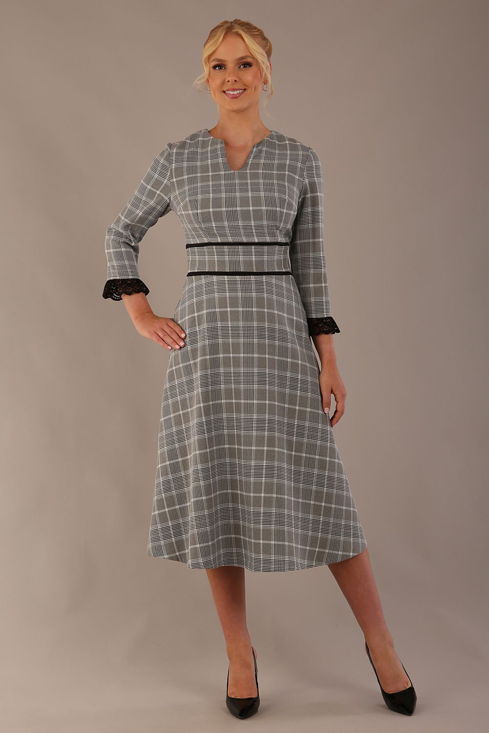 Model wearing the Hendricks check midi dress in misty grey with black lace cuffs and a V-neck (Misty Grey Check)