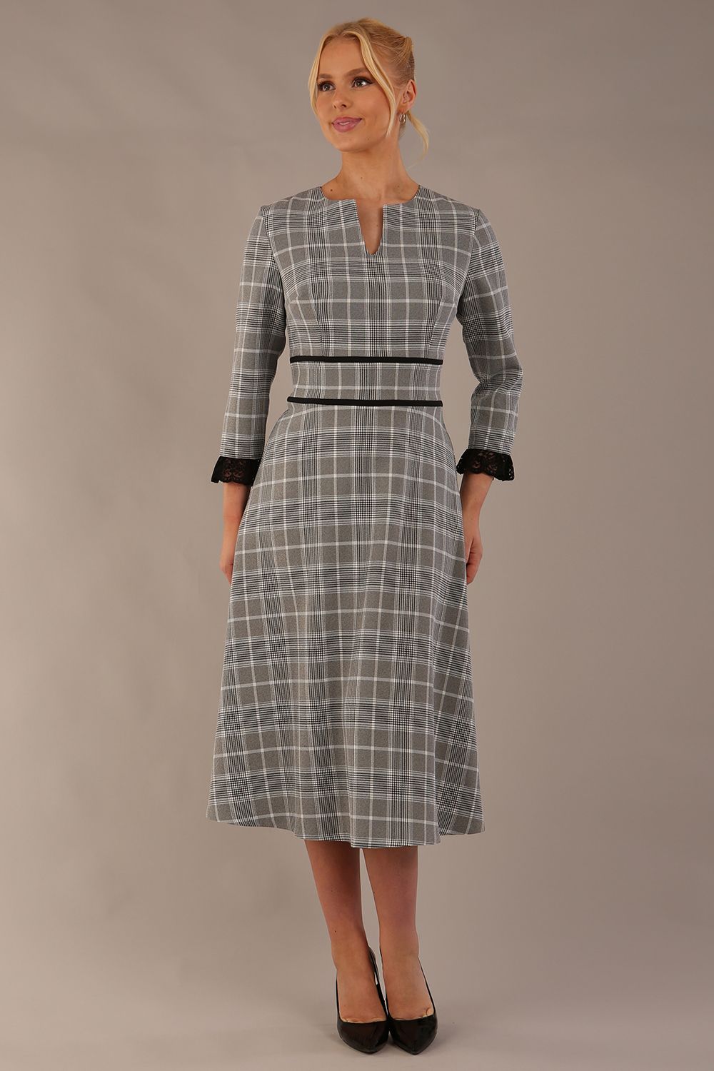 Model wearing the Hendricks check midi dress in misty grey with black lace cuffs and a V-neck (Misty Grey Check)