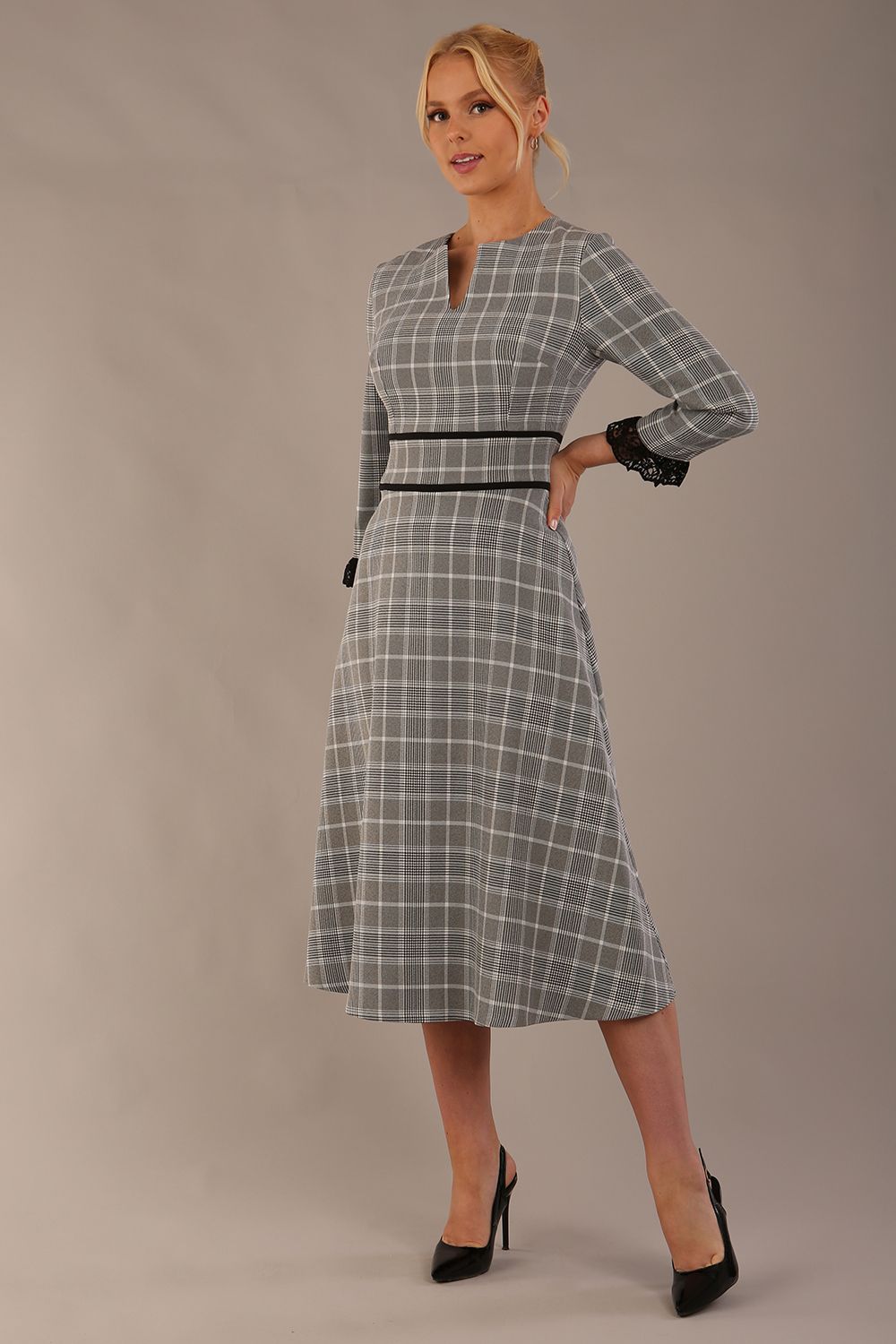 Model wearing the Hendricks check midi dress in misty grey with black lace cuffs and a V-neck (Misty Grey Check)