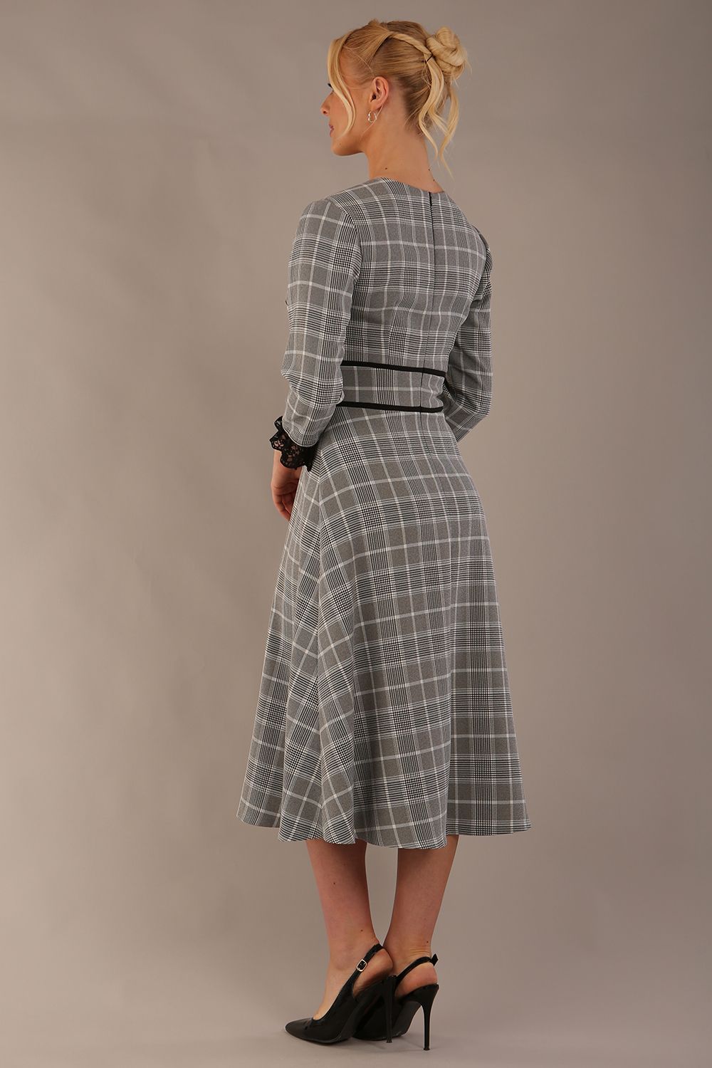 Model wearing the Hendricks check midi dress in misty grey with black lace cuffs and a V-neck (Misty Grey Check)