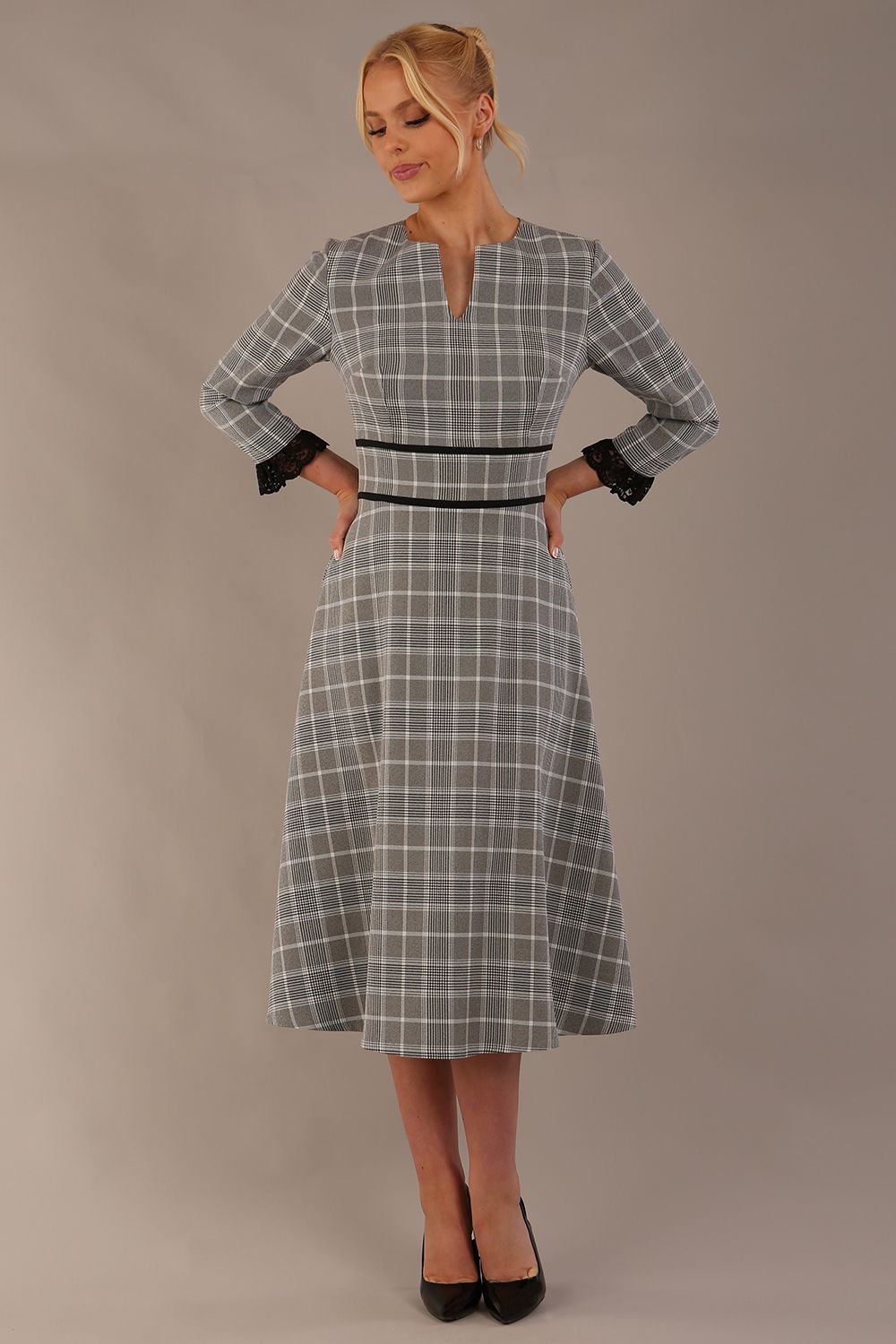 Model wearing the Hendricks check midi dress in misty grey with black lace cuffs and a V-neck (Misty Grey Check)