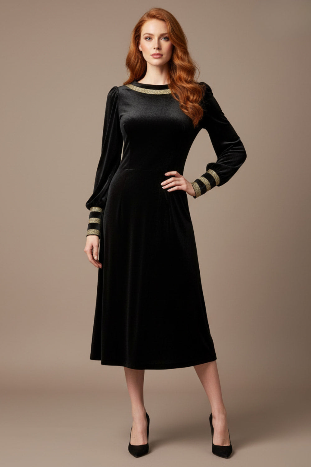 Woman wearing a black dress with gold accents sitting on a stool against a beige background (Black Velvet with Sherwood Glitter Contrast)