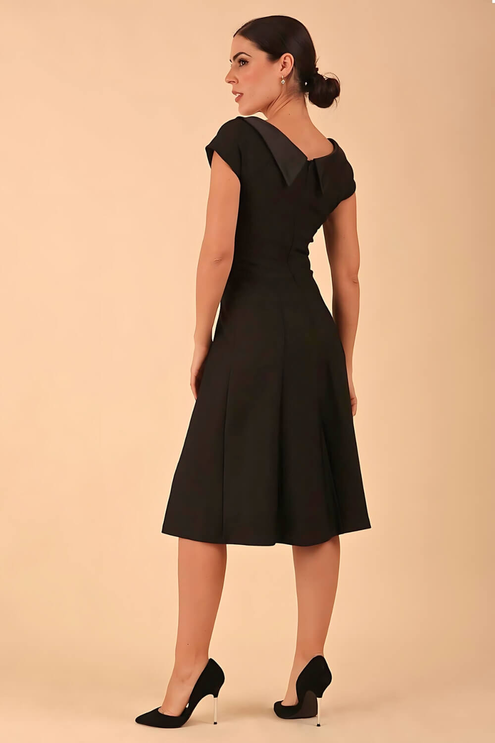 model wearing a diva catwalk Bowmore V-Neck A-line Dress cap sleeve in black colour