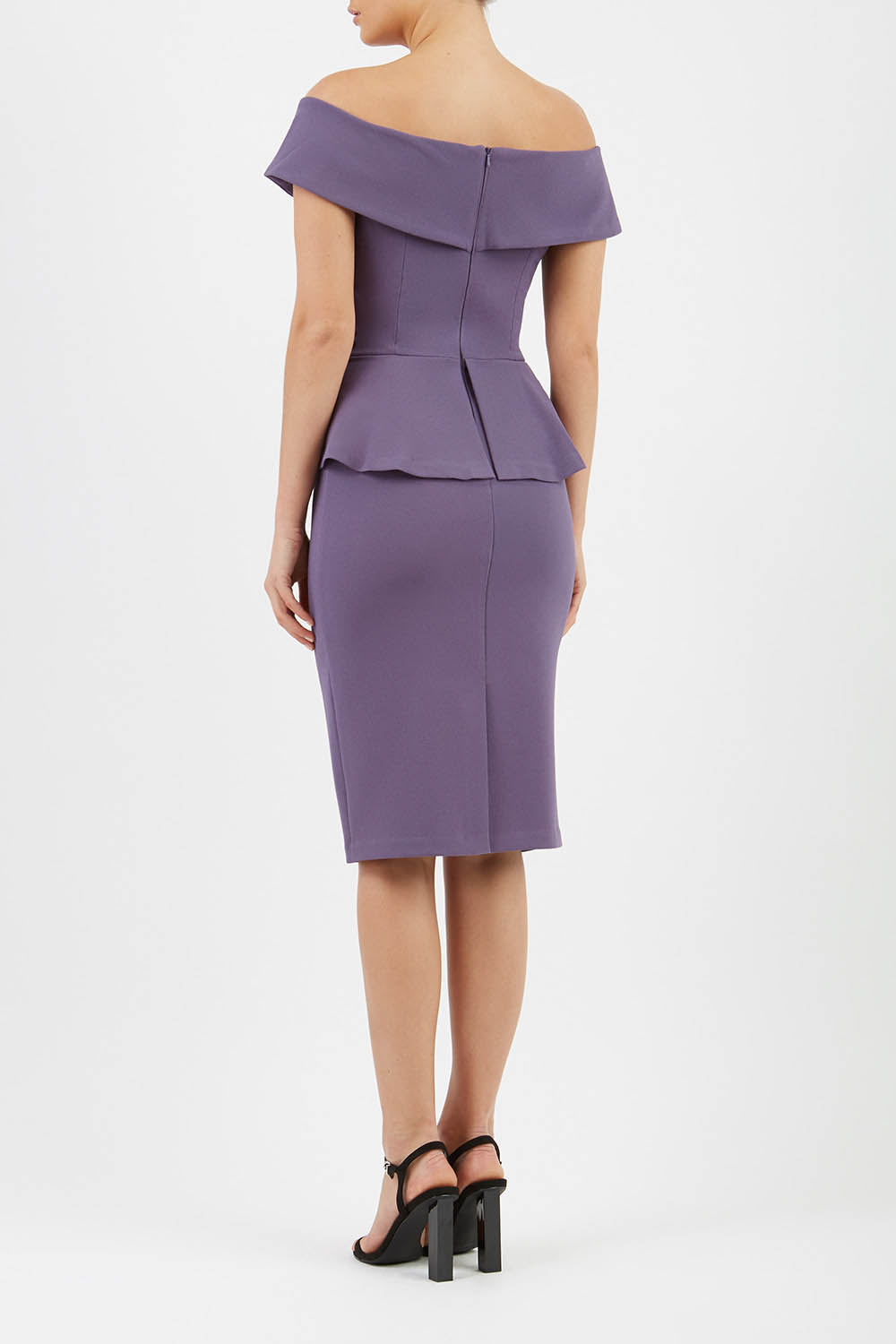 blonde model wearing diva catwalk peplum pencil skirt dress in mauve colour off shoulder bardot neckline front