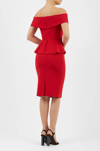 blonde model wearing diva catwalk peplum pencil skirt dress in scarlet red colour off shoulder bardot neckline front