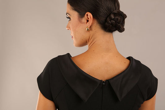 model wearing diva catwalk little black dresses with low v-nwcklinw and pencil skirt sleeveless style front