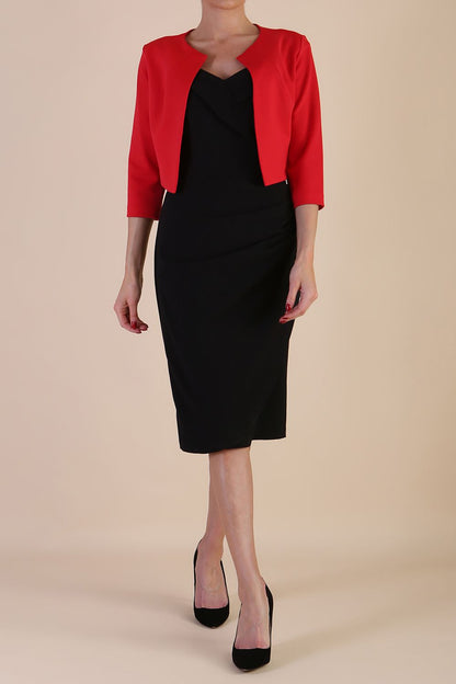 brunette model wearing diva catwalk red sleeved bolero over a printed pencil dress front