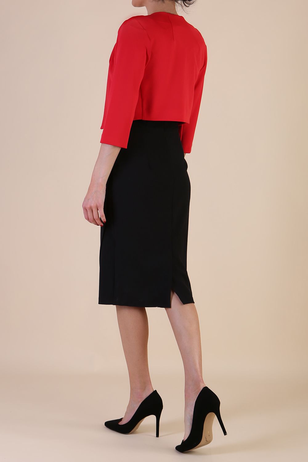 brunette model wearing diva catwalk red sleeved bolero over a printed pencil dress front