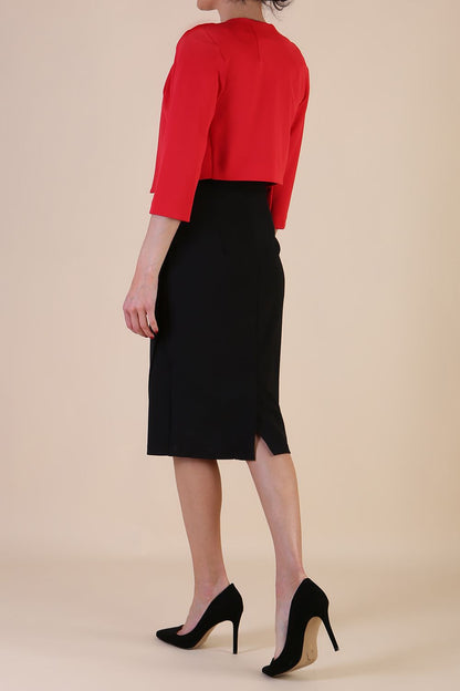brunette model wearing diva catwalk red sleeved bolero over a printed pencil dress front