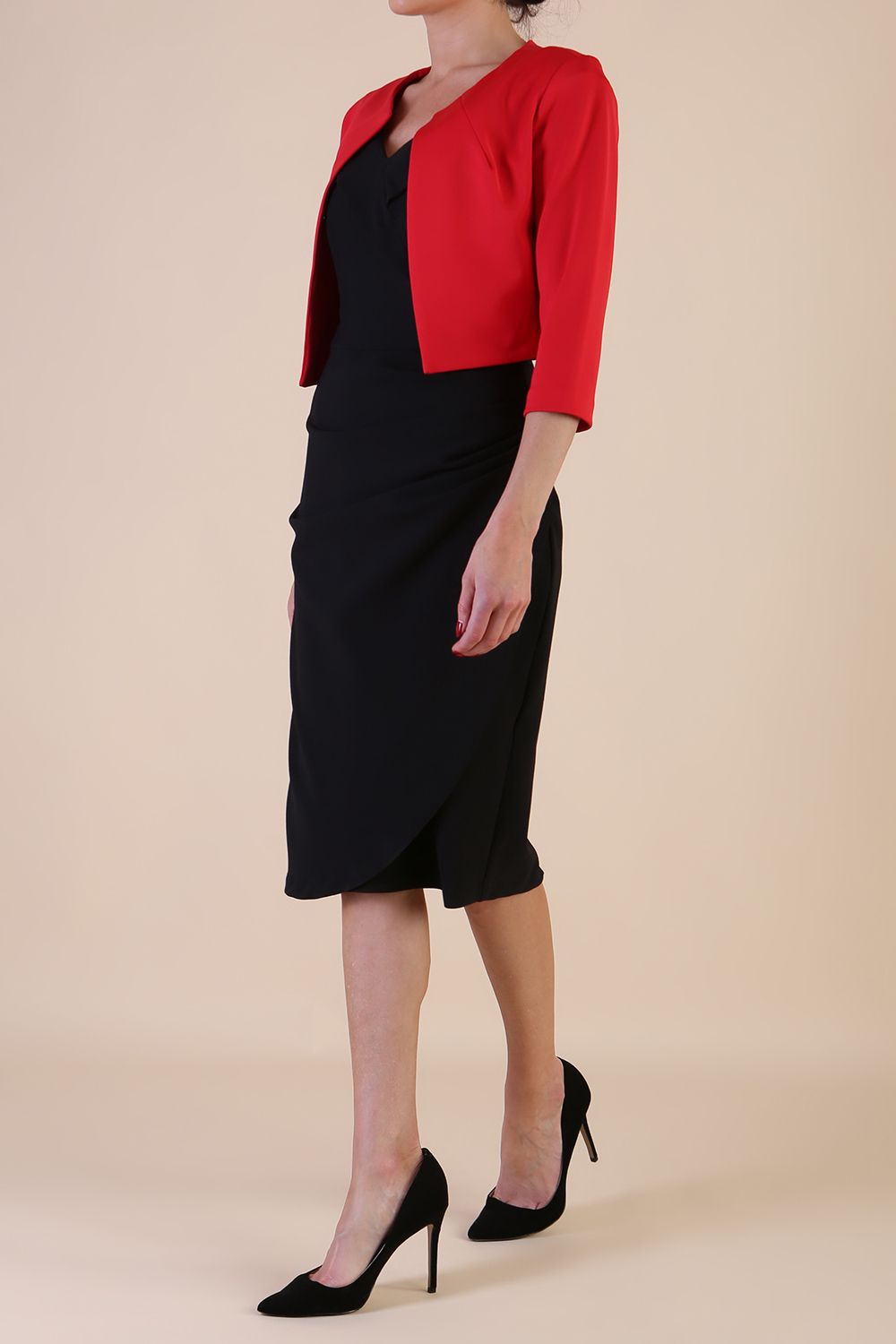 brunette model wearing diva catwalk red sleeved bolero over a printed pencil dress front