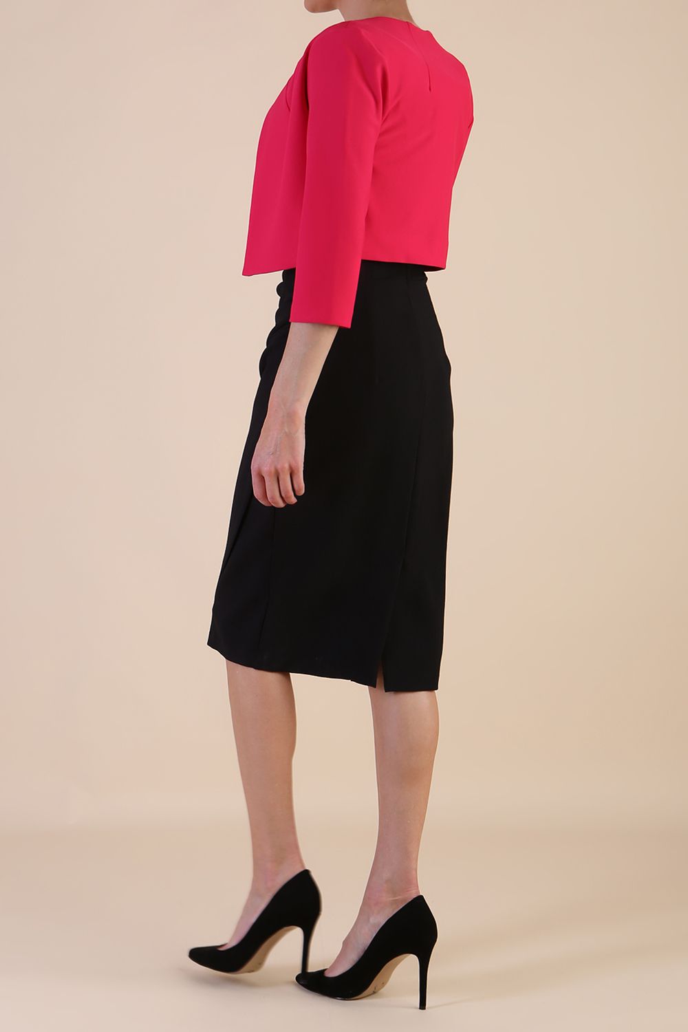 brunette model wearing diva catwalk pink sleeved bolero over a printed pencil dress front