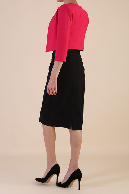 brunette model wearing diva catwalk pink sleeved bolero over a printed pencil dress front
