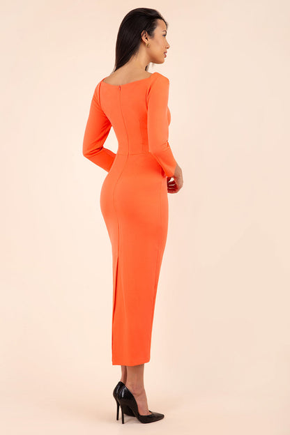 brunette model wearing diva catwalk maxi plain three quarter sleeve dress with pleating on shoulders and square neckline in hot coral front