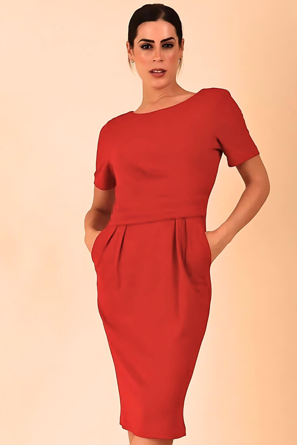 Brunette model is wearing marcel stretch short sleeve pencil dress image in tango red colour