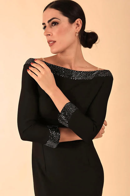 Model wearing a diva catwalk ToTo Bardot Neckline Off Shoulder Pencil Dress in Black colour Back Full Body Image