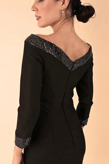 Model wearing a diva catwalk ToTo Bardot Neckline Off Shoulder Pencil Dress in Black colour Back Full Body Image