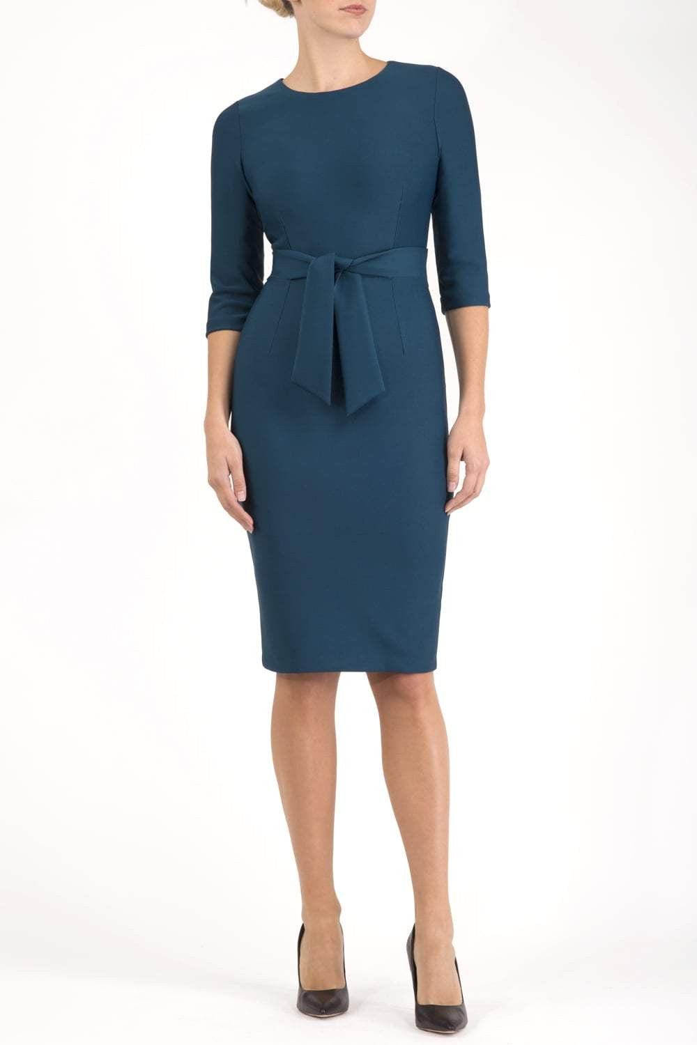 Model wearing the Diva Amatis Pencil dress with round neckline, inserted tie detailing at the front in glorious teal front image
