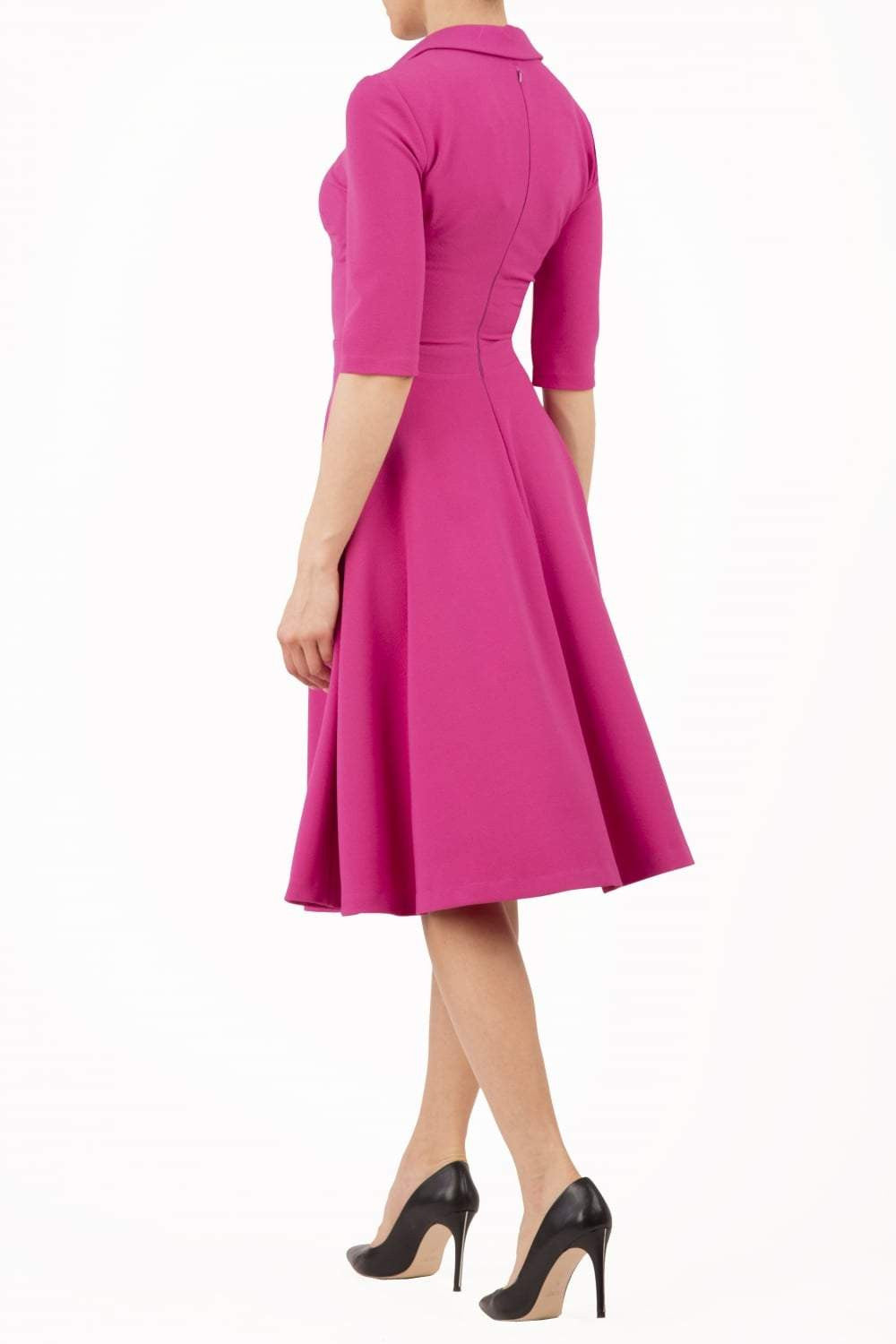 Model wearing the Diva Annette Swing Dress with V shaped neckline with zip detail in fuschia pink front image
