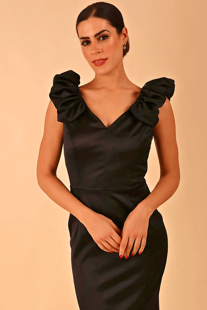 model is wearing a diva catwalk Prudence Satin Pencil Dress sleeveless and knee length with front vent in black colour (Black)