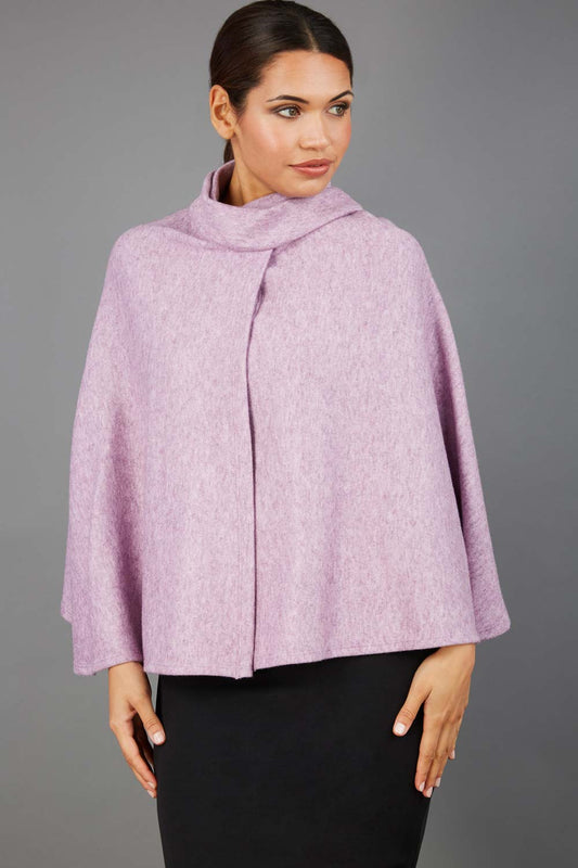 brunette model wearing diva catwalk hampstead cape known as shawl high neck in pink front