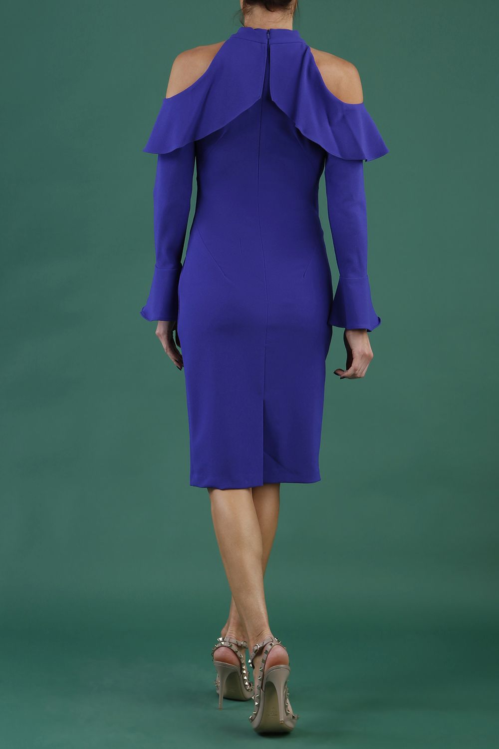 brunette model is wearing diva catwalk liah long sleeve cold-shoulder pencil dress with high neck in spectrum indigo front
