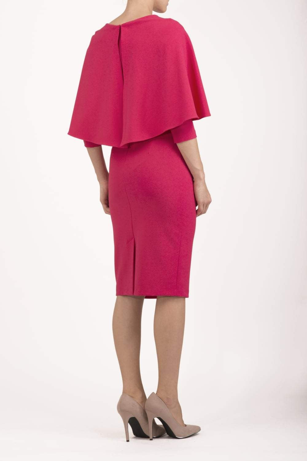 model wearing diva catwalk lizanne pencil-skirt dress with an attached wide cape detail and 3 4 sleeves in colour Dazzle pink back