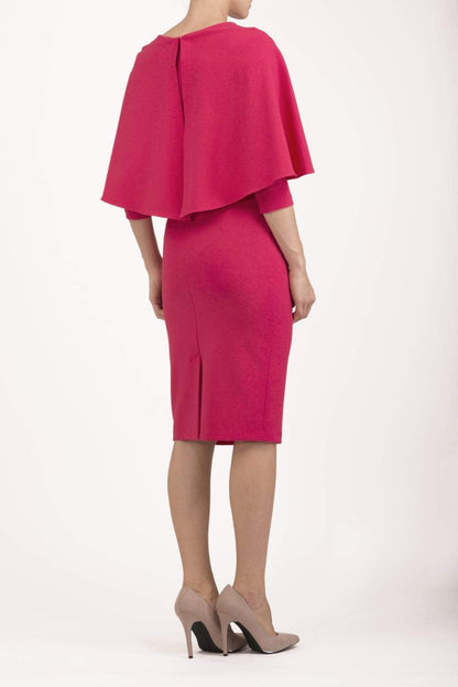 model wearing diva catwalk lizanne pencil-skirt dress with an attached wide cape detail and 3 4 sleeves in colour Dazzle pink back