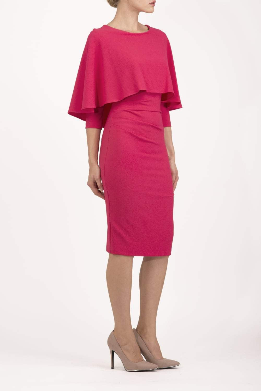 model wearing diva catwalk lizanne pencil-skirt dress with an attached wide cape detail and 3 4 sleeves in colour Dazzle pink back