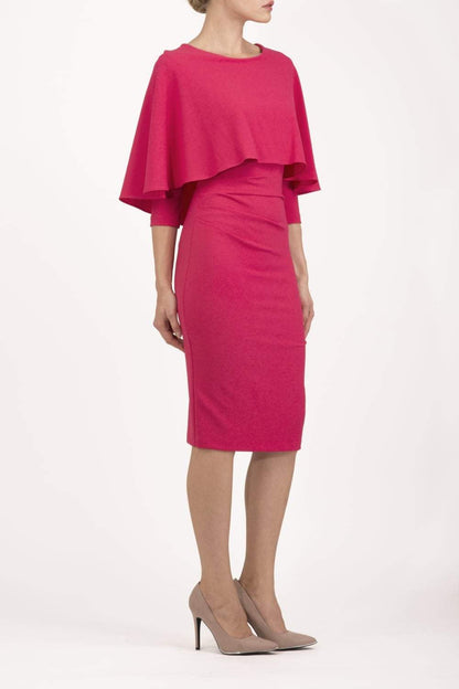model wearing diva catwalk lizanne pencil-skirt dress with an attached wide cape detail and 3 4 sleeves in colour Dazzle pink back