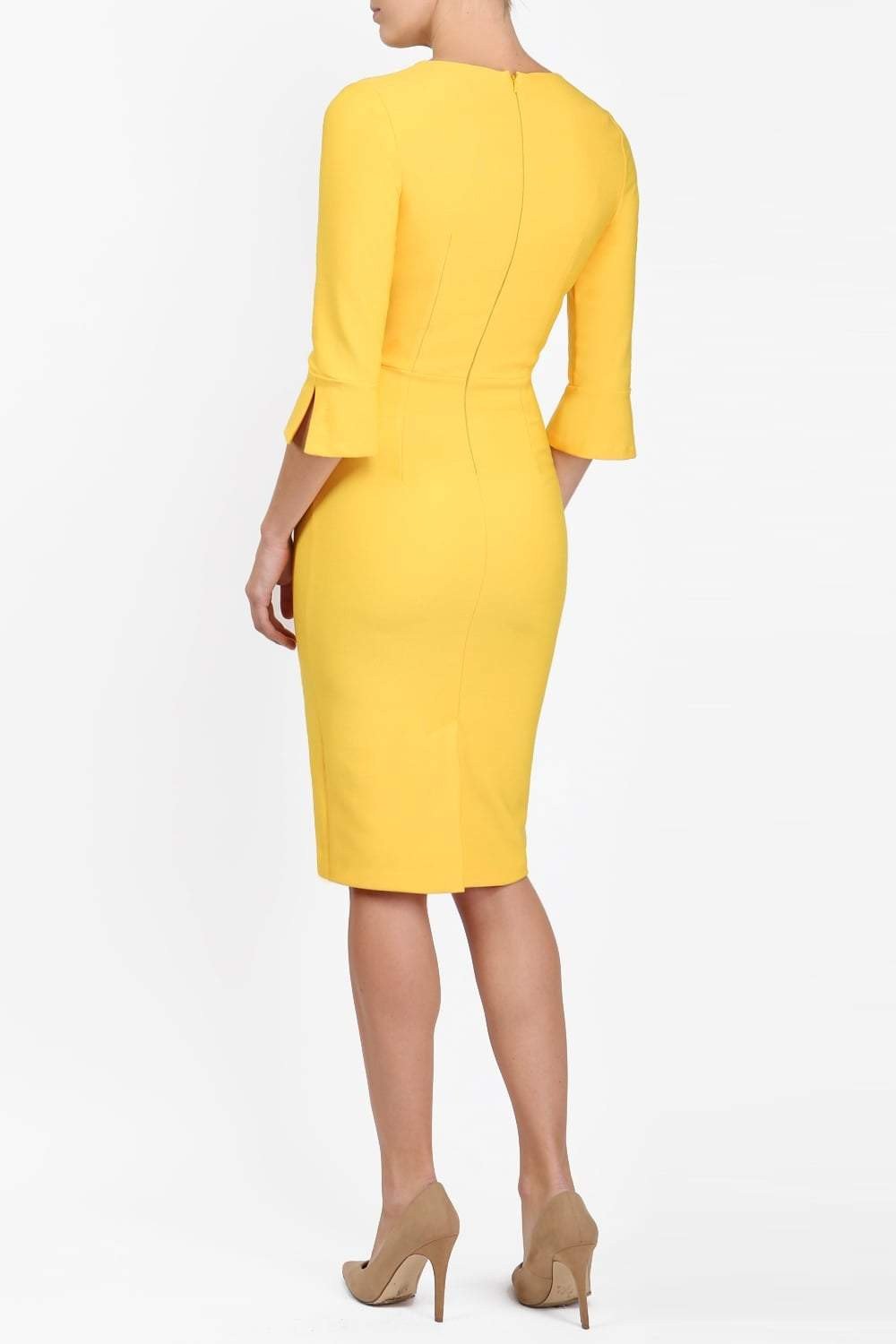 Brunette model is wearing couture stretch seed pencil bell 3/4 sleeve pencil dress by diva catwalk in Daffodil Yellow front image