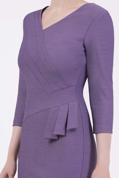 A model wearing a purple, sleeved pencil dress with a textured bodice and a V-neckline.