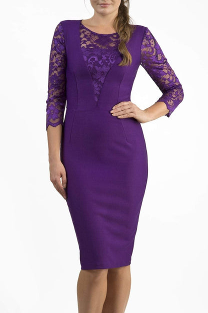 Brunette Model is wearing a seed couture lace pencil dress by diva catwalk in purple front