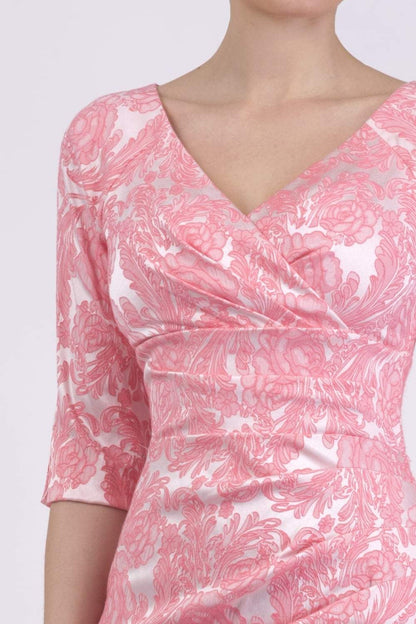 brunette model wearing diva catwalk venice jacquard pancil fitted summer dress with sleeves and low v-neckline in pale pink colour front